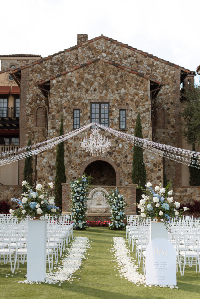 Detailed shot of Bella Collina wedding décor, including floral arrangements and elegant table settings, photographed by The Deans Photography.