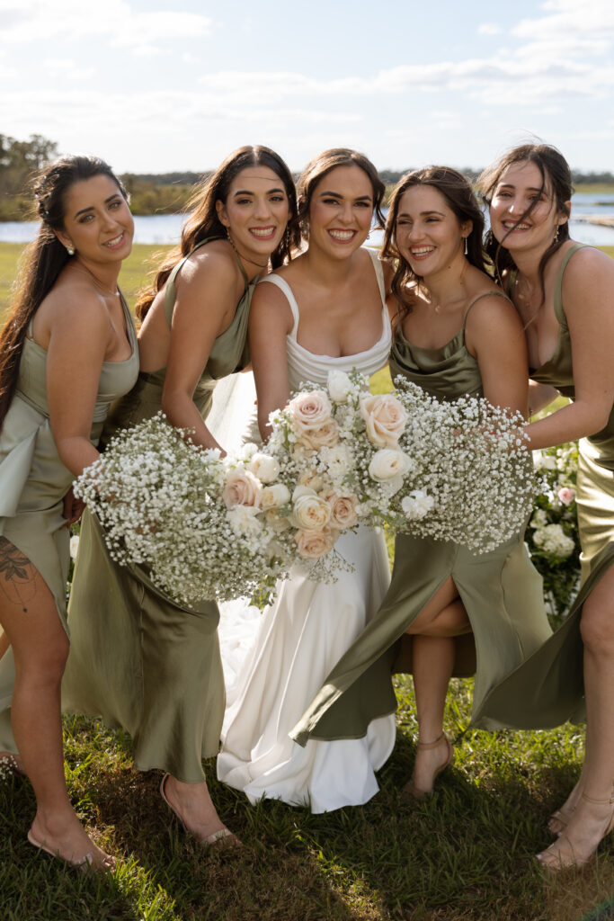 Lavender on the Lake wedding photographed by The Deans Photography, showcasing a serene lakeside setting with lavender fields and lush greenery as the backdrop.