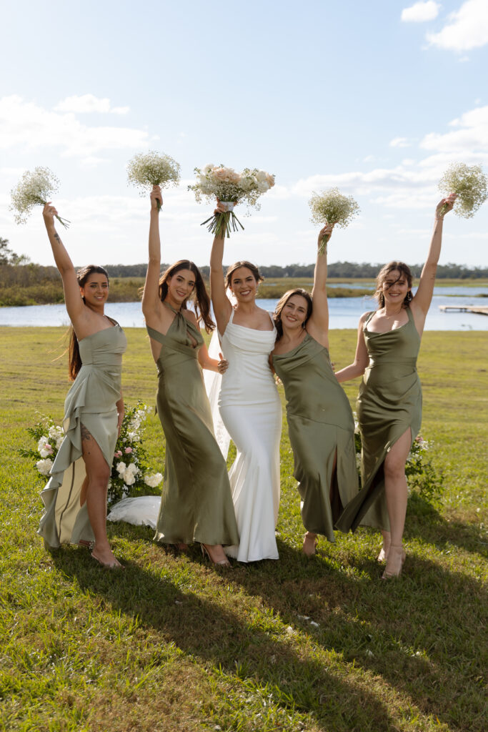 Lavender on the Lake wedding photographed by The Deans Photography, showcasing a serene lakeside setting with lavender fields and lush greenery as the backdrop.