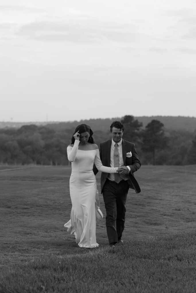 Bride and groom during sunset at Bella Collina, captured by The Deans Photography, with the sun setting over the picturesque hills and Tuscan architecture.