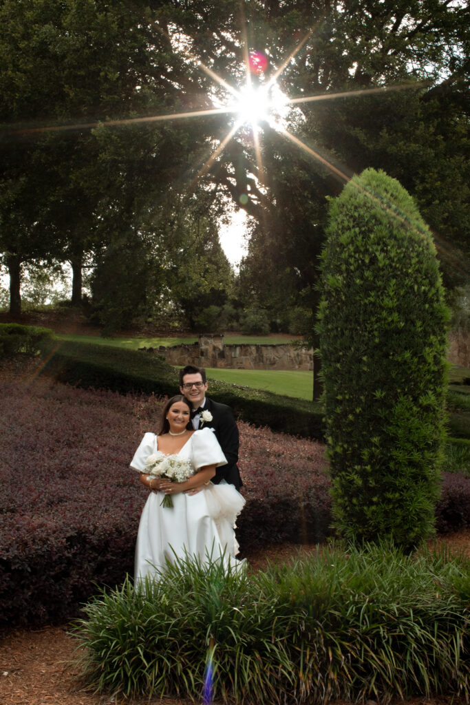 Bride and groom during sunset at Bella Collina, captured by The Deans Photography, with the sun setting over the picturesque hills and Tuscan architecture.