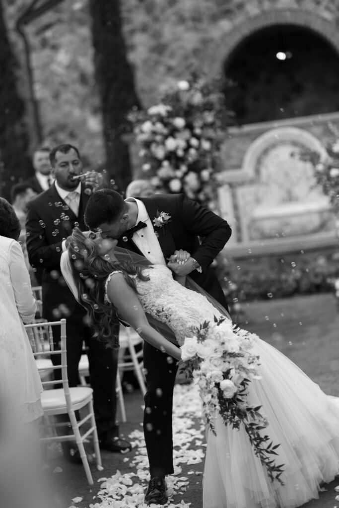 Couple just married at their wedding venue at Bella Collina photographed by The Deans Photography.