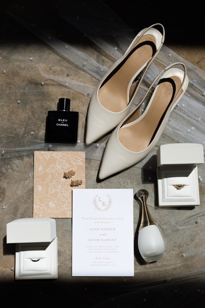 Flat-lay details with a Tuscan backdrop photographed by The Deans Photography.