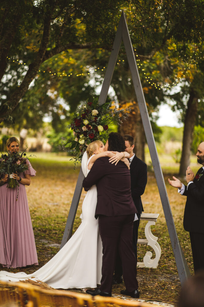 Couple at their outdoor ceremony in Vero Beach, Florida. Photographed by The Deans Photography