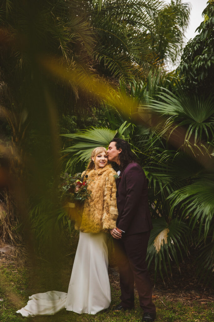 Intimate moment of couple at their tropical wedding venue, photographed by The Deans Photography.