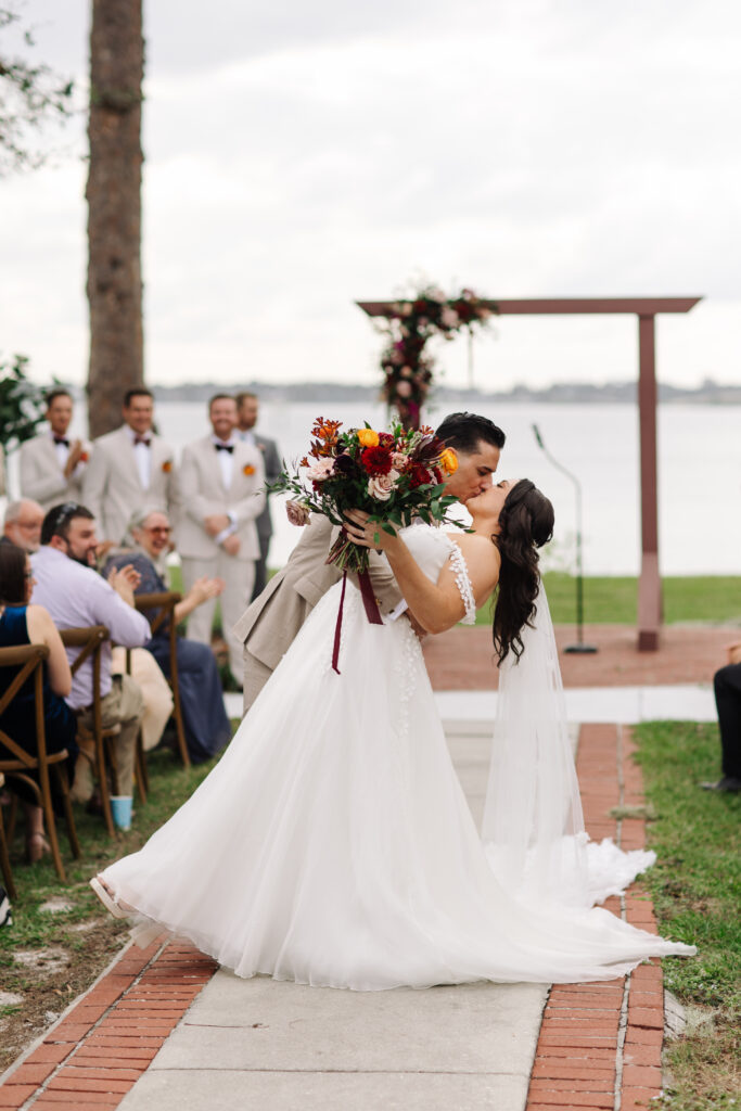 Couple walking down the aisle in Merritt Island, Florida. photographed by The Deans Photography