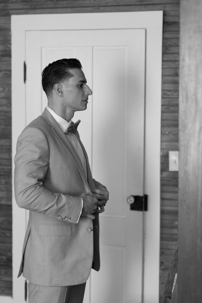 Groom in suite atField Manor, photographed by The Deans Photography