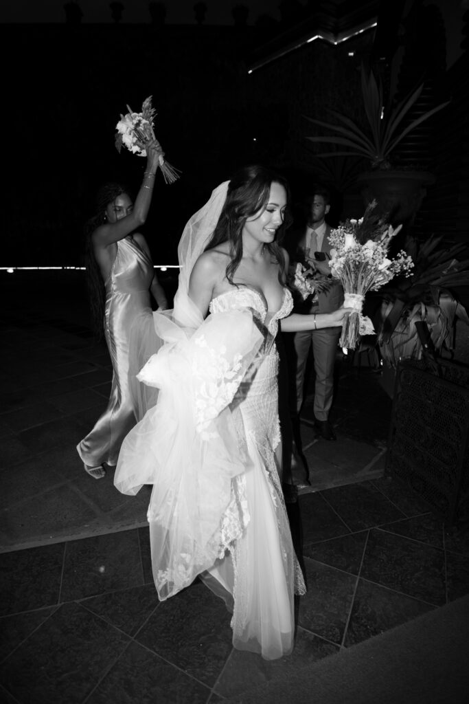 Wedding guests celebrating and enjoying the reception at Villa Caletas, Costa Rica, during a destination wedding captured by The Deans Photography.