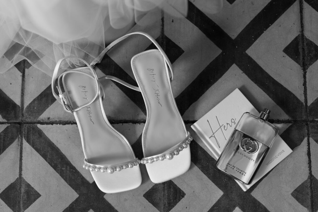 Close-up of wedding details including bride’s dress, shoes, and rings, captured at a destination wedding in Costa Rica by The Deans Photography.