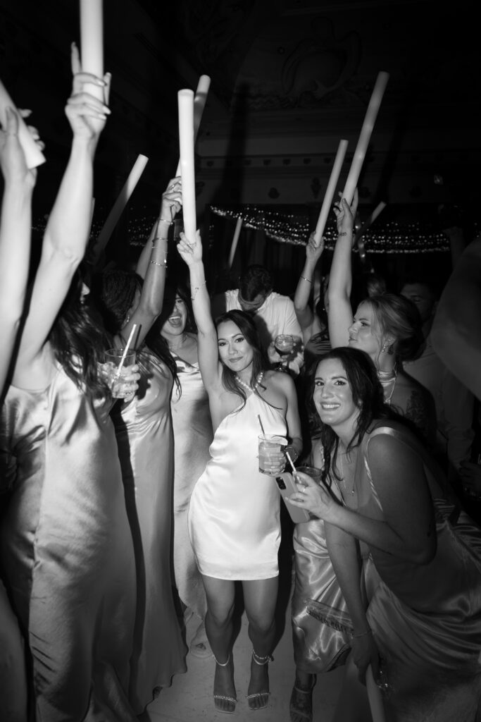 Wedding guests celebrating and enjoying the reception at Villa Caletas, Costa Rica, during a destination wedding captured by The Deans Photography.