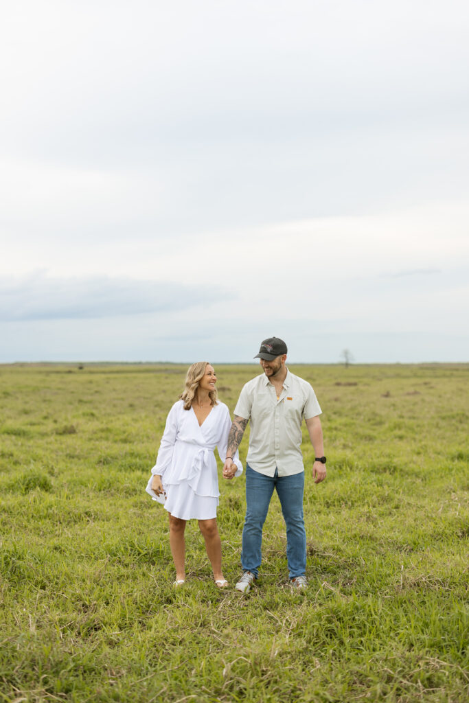 Couple standing in a field