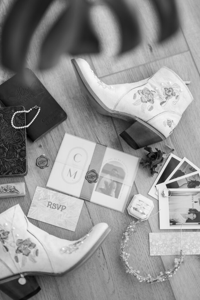 Wedding invitation suite with floral accents, captured in a stunning flat lay arrangement.