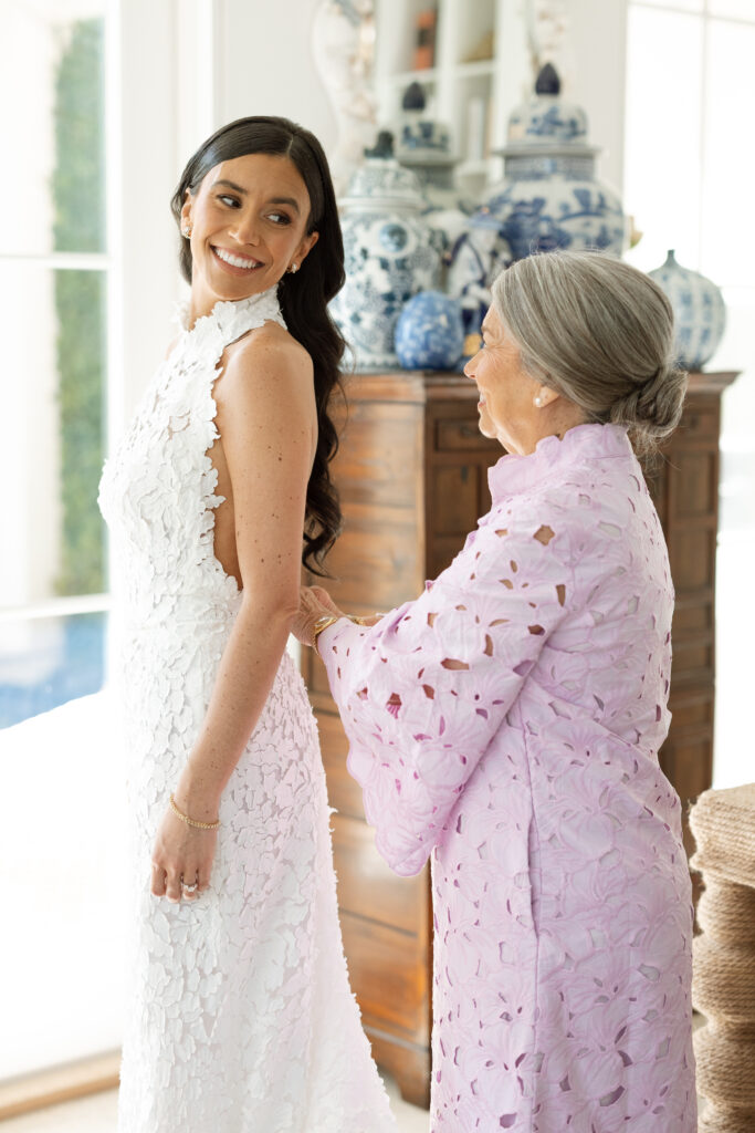 Bride getting ready in natural light at the Vero Beach Hotel, wearing a sleek gown for her intimate Florida elopement