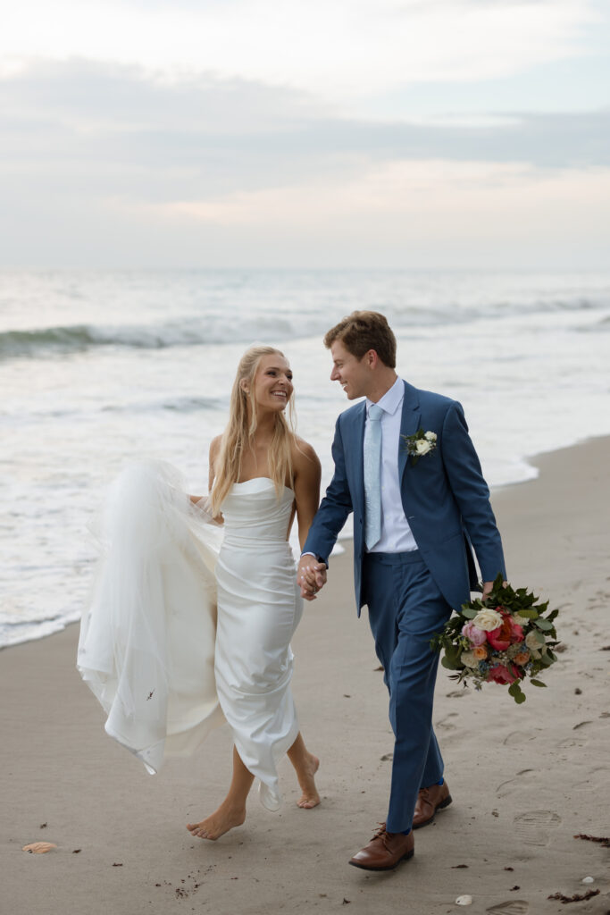 seaside wedding creative photo of couple holding hands