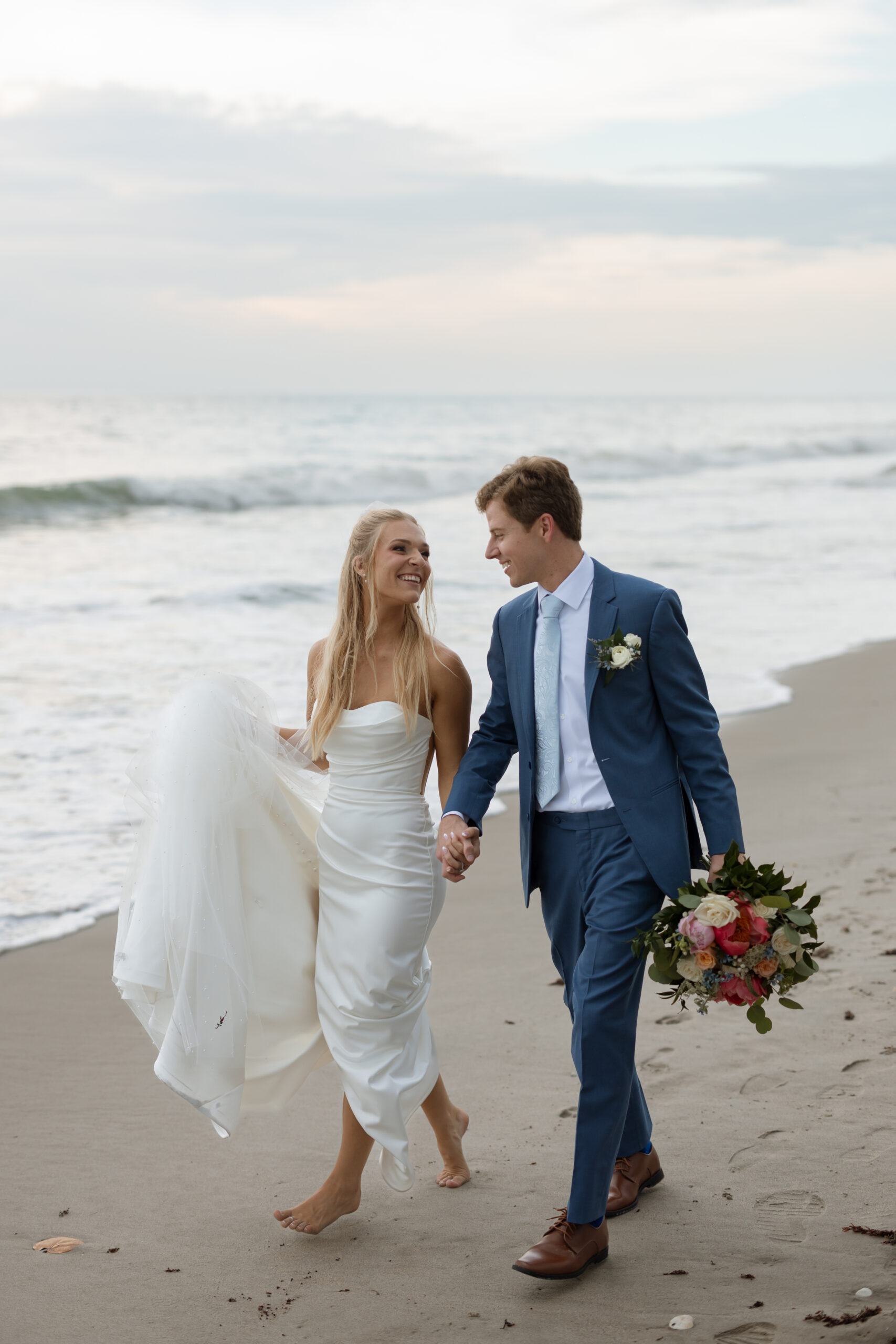seaside wedding creative photo of couple holding hands