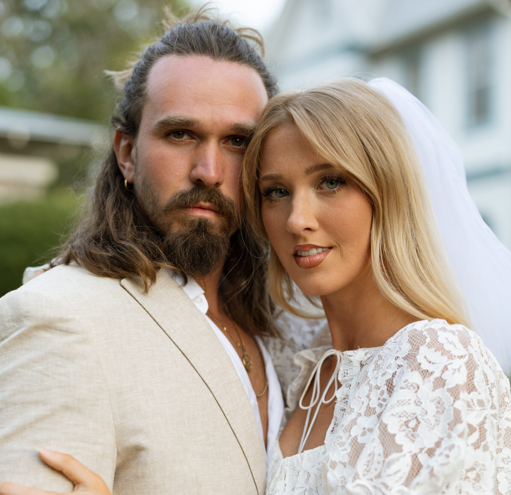 Couple wearing wedding attire for their engagement session