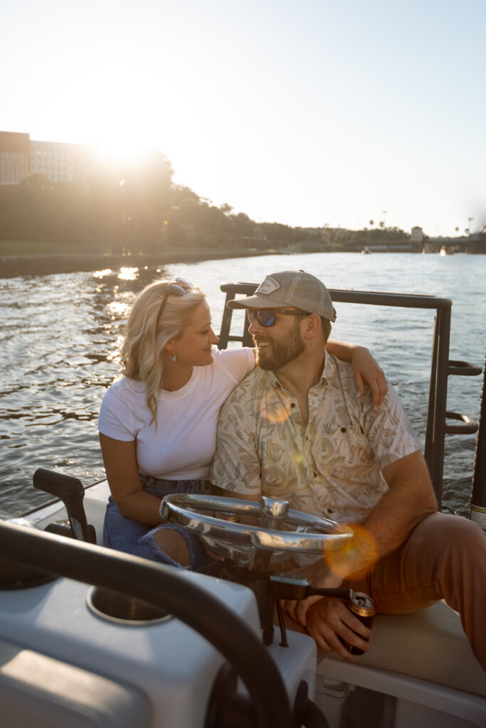 Engaged couple together on a boat during their engagement session
